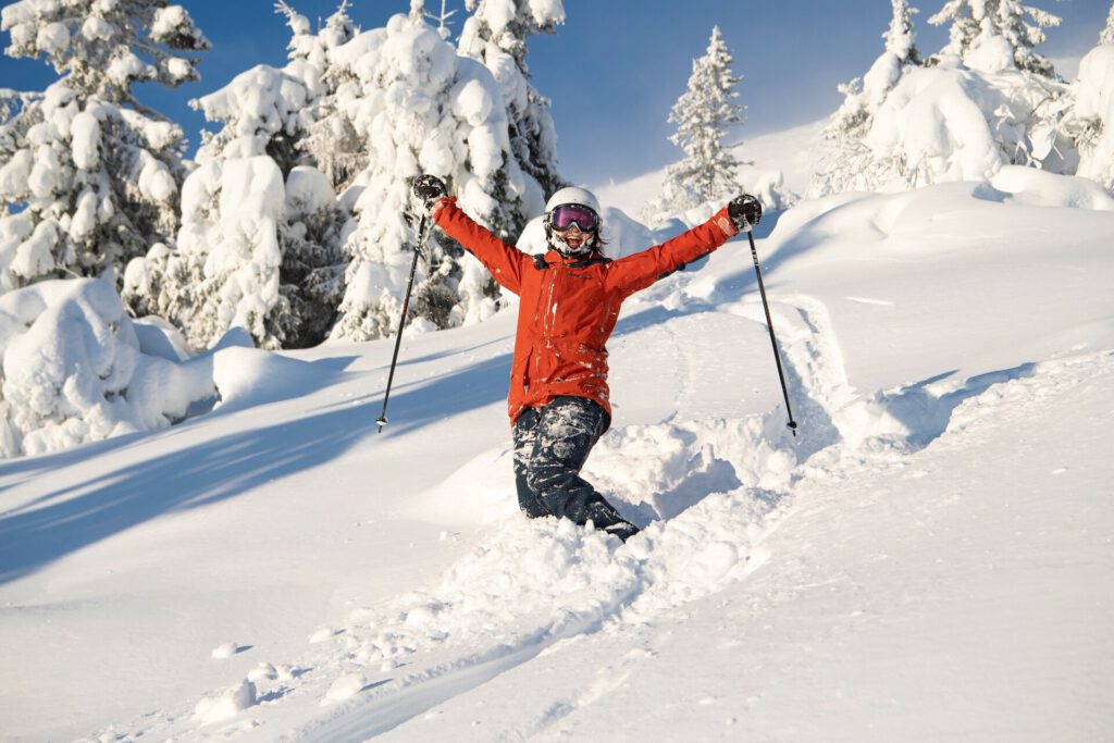 Happy female skier in powder snow in Trysil_